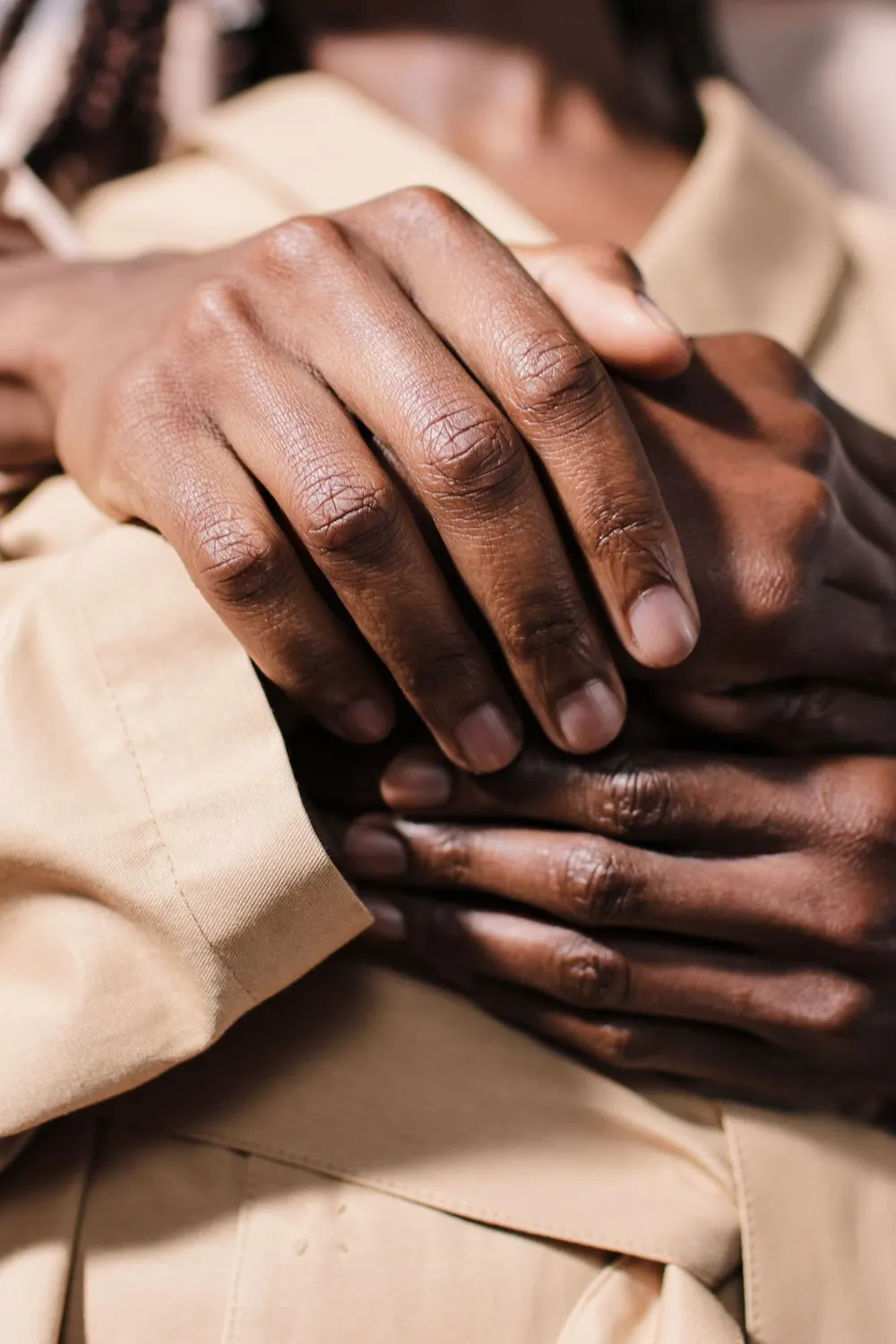 Couple holding each other&rsquo;s hands in support